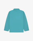 Back view of aqua-blue, buttoned organic cotton overshirt with view of reinforced elbow area and boxy silhouette.