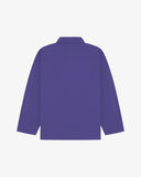 Back view of purple, buttoned organic cotton overshirt with view of reinforced elbow area and boxy silhouette.