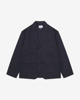 Full front view of organic cotton twill deep blue docklands blazer from Uskees. Clearly showing 2-button fastening, 3 jetted pockets and Uskees brand labels.