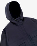 Front view of Uskees midnight blue Evo shell coat with focus on hood and toggles.
