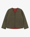 Front view of Uskees army green Evo liner jacket showing the two welt pockets and two-way YKK double-ended zip