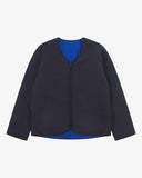 Front view of Uskees midnight blue Evo liner jacket showing the two welt pockets and two-way YKK double-ended zip