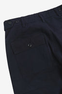 Close up back shot of Uskees 5005 twill workwear pants in deep blue with focus on back pocket, adjustable waistband secured with Corozo button and belt loops.
