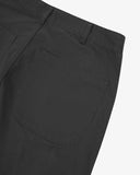 Close-up reverse view of Uskees charcoal grey twill pants with focus on left rear patch pocket and belt loops.