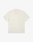 Back view flat shot of Uskees cream linen blend short-sleeve Cuban shirt for men.