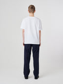 Back view of model wearing 7006 white organic cotton t-shirt.