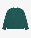 Full flat view of the Uskees green organic cotton long-sleeve T-shirt for men, showing the breast pocket, mini branding label and loose silhouette.