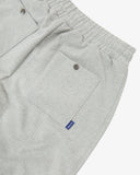 Close-up of gray marl sweatpants for men showing the elasticated waist, back pockets and metal popper fastening.